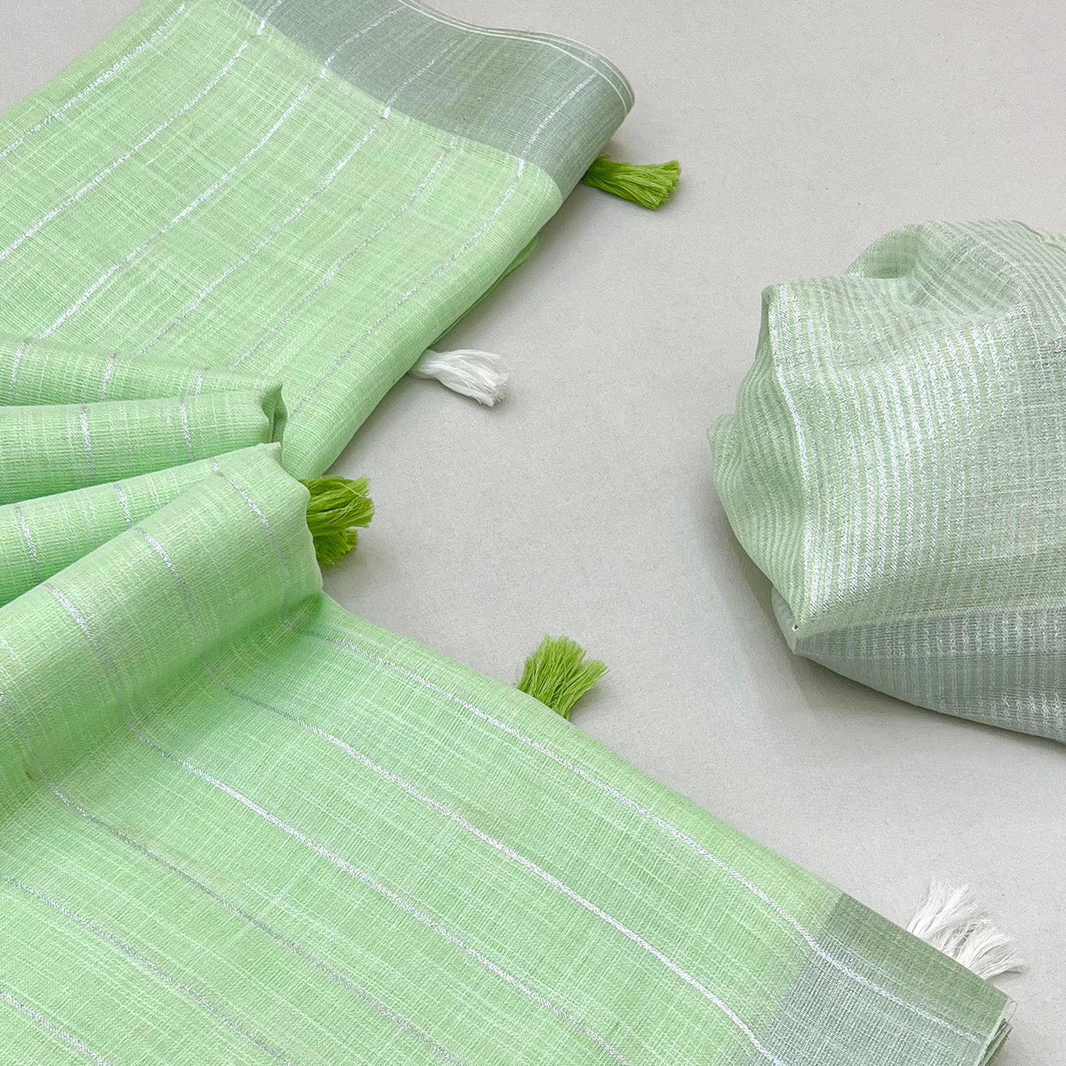 green-zari-woven-linen-saree-with-tassels-10