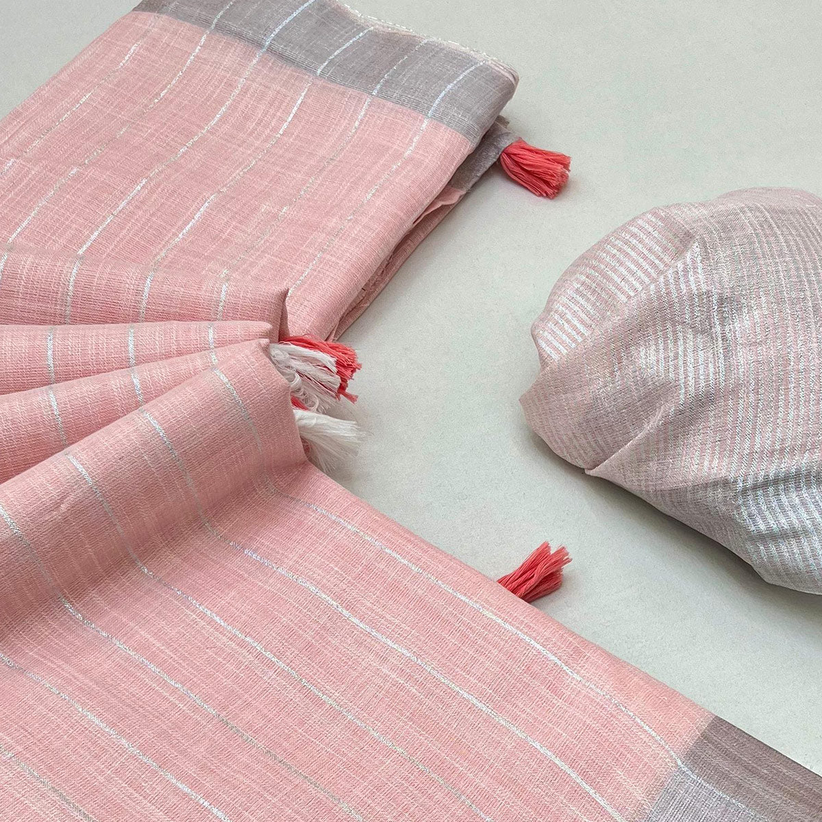 Light Pink Zari Woven Linen Saree With Tassels