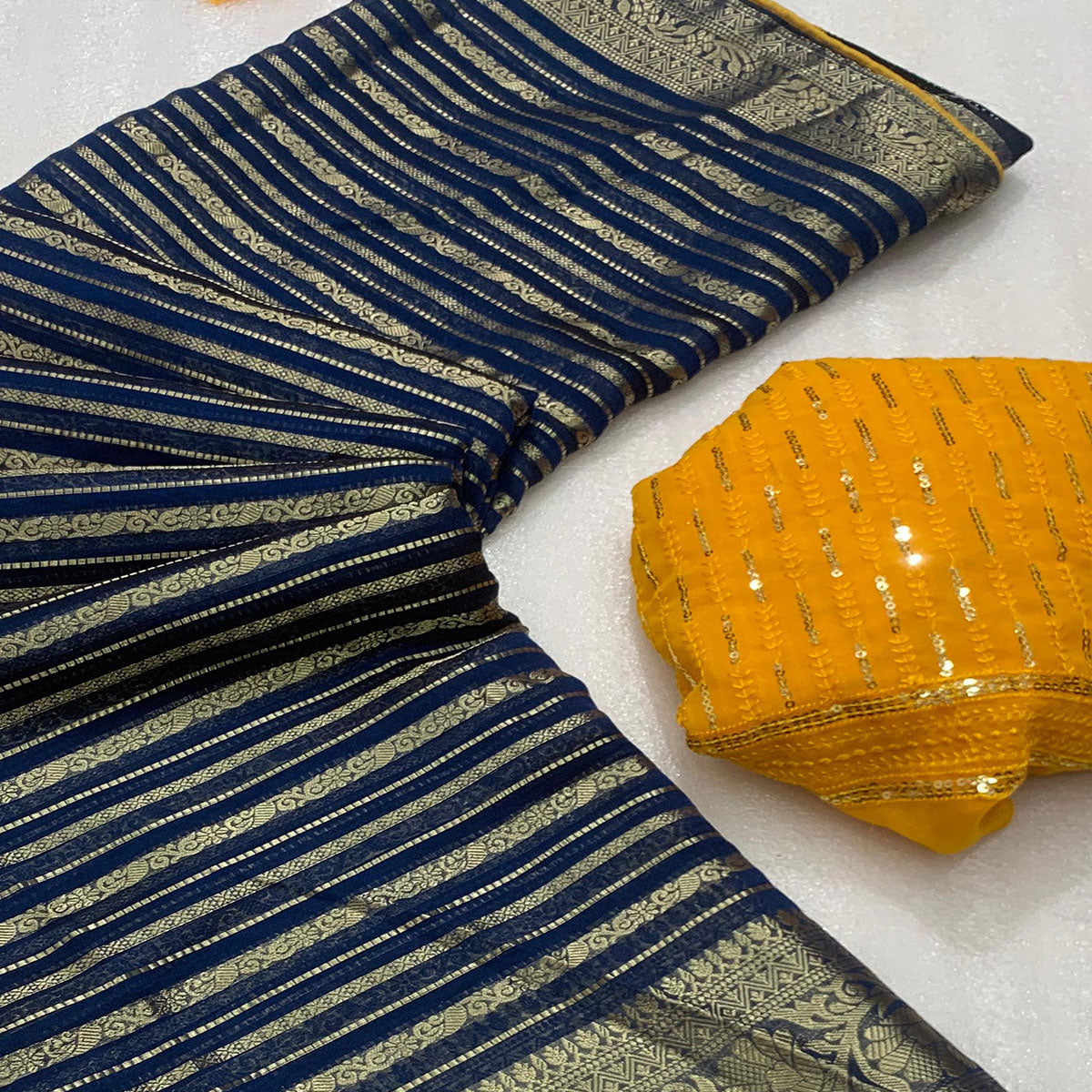 Blue Woven Georgette Saree With Tassels