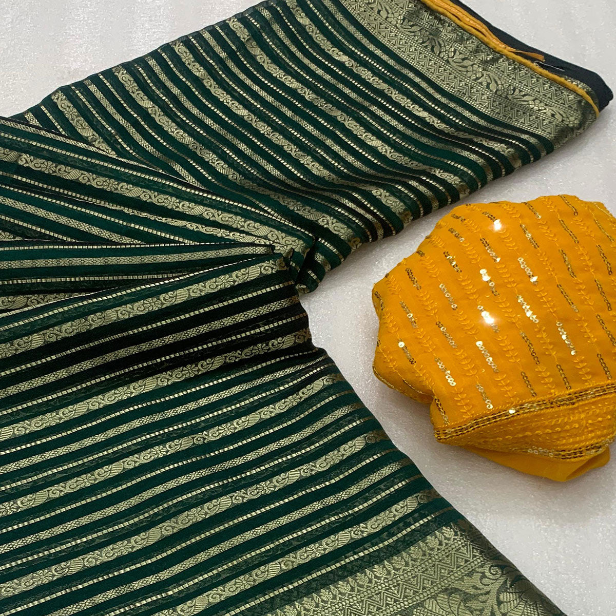 Dark Green Woven Georgette Saree With Tassels