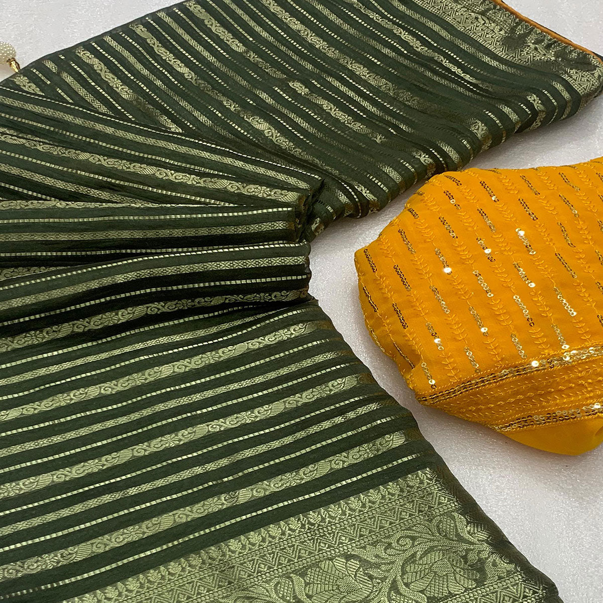 green-woven-georgette-saree-with-tassels-5