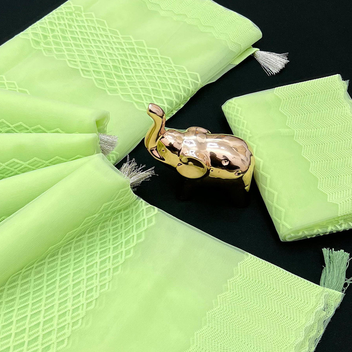 green-woven-thread-work-net-saree-with-tassels