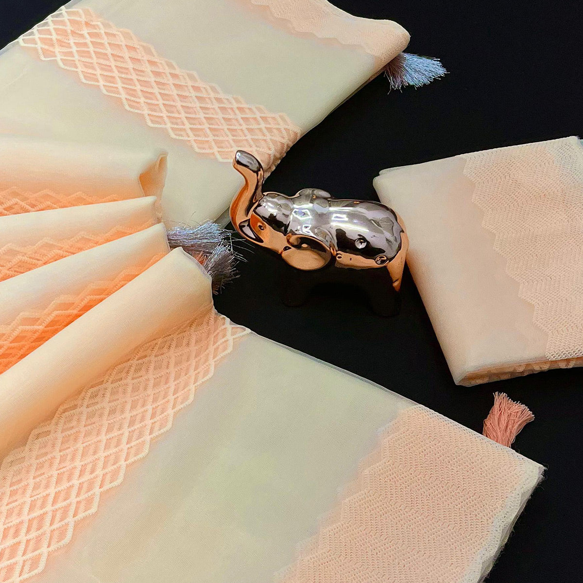 Light Peach Woven Thread Work Net Saree With Tassels