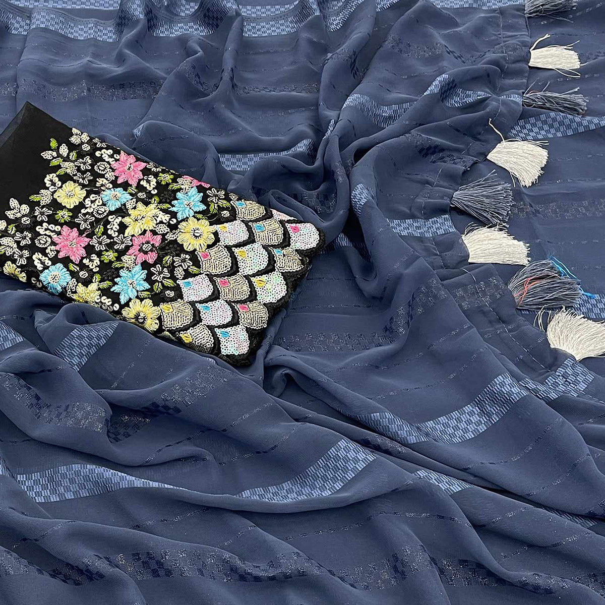 Bluish Grey Woven Georgette Saree With Tassels