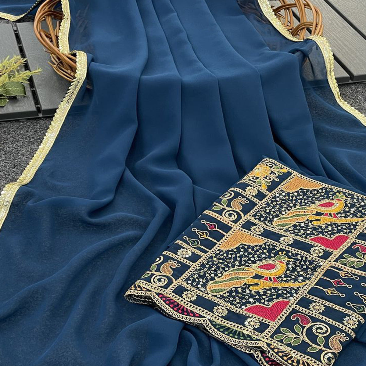 Blue Solid Georgette Saree With Sequins Embroidered Border