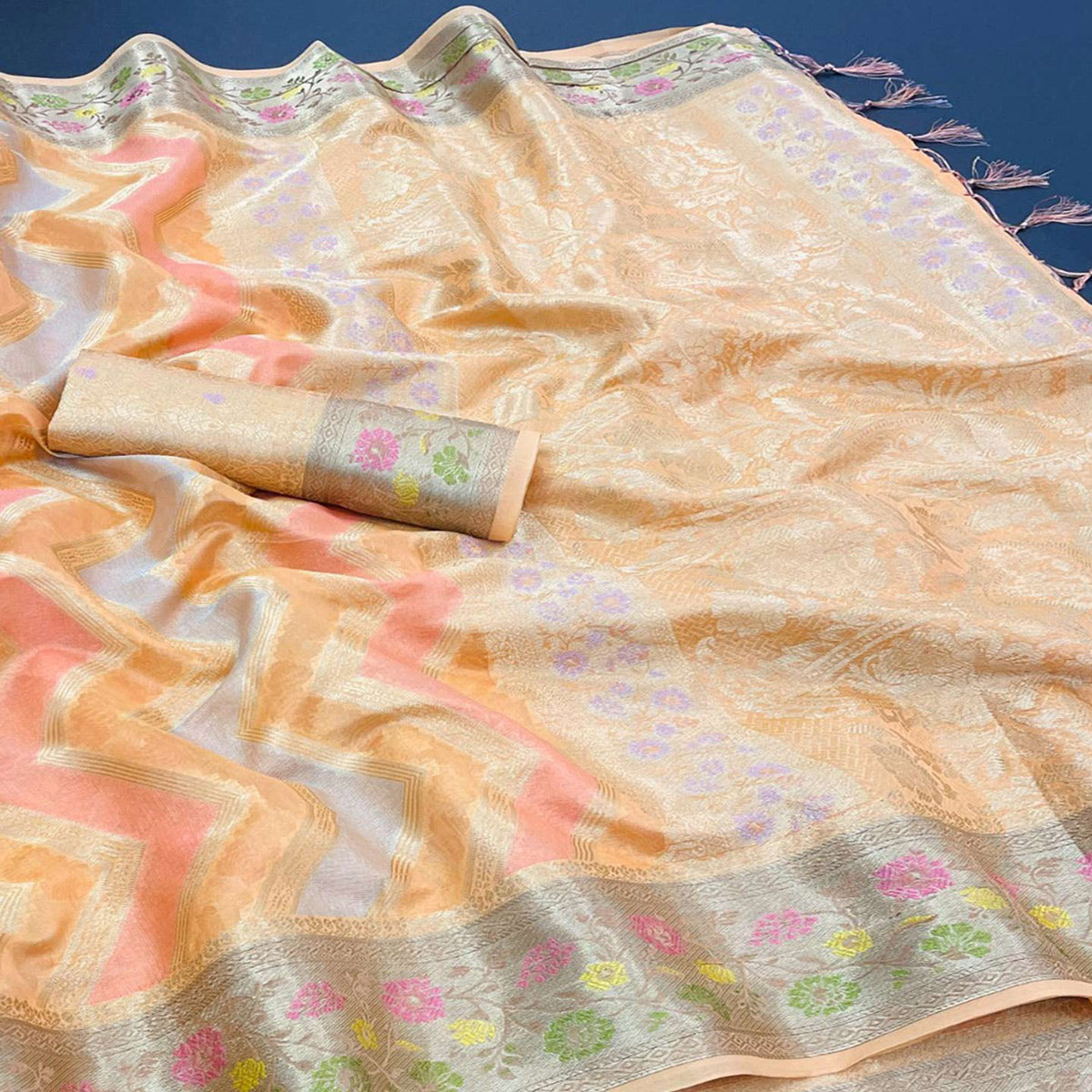 Light Orange Woven Organza Saree With Tassels