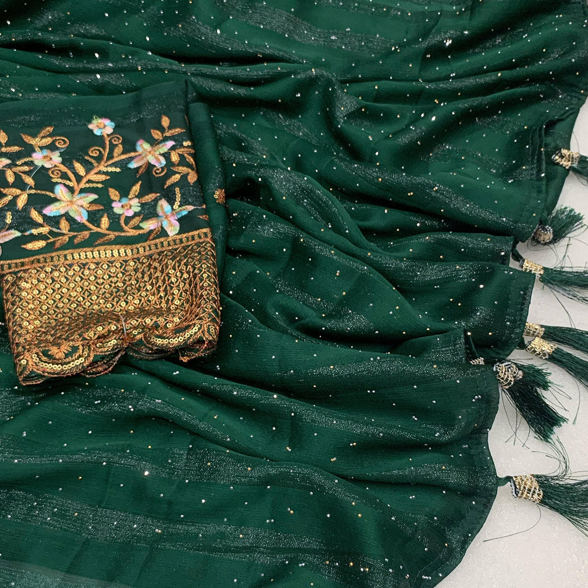 green-woven-swaroski-work-georgette-saree-with-tassels
