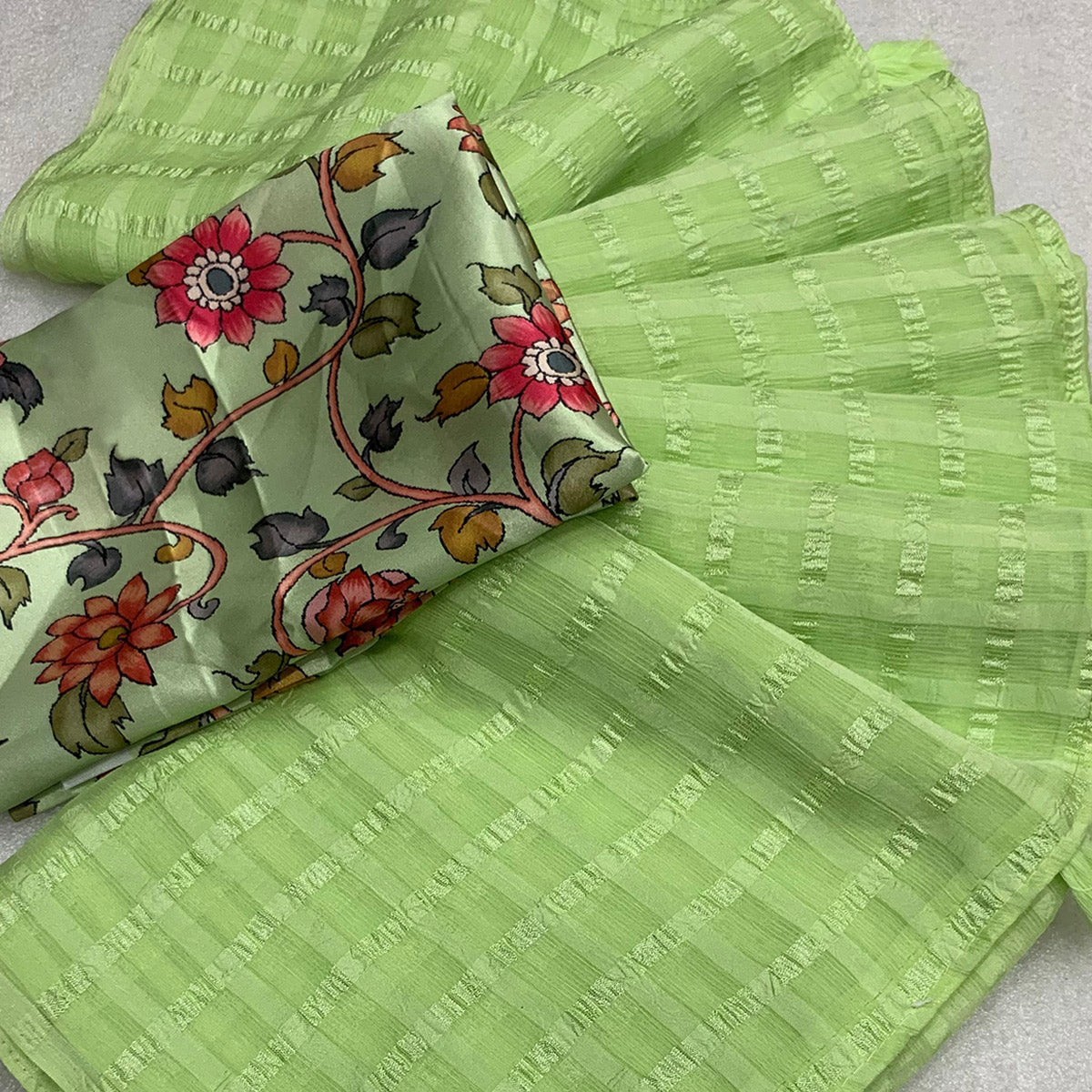 green-woven-chiffon-wrinkle-saree-with-tassels