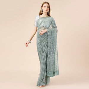 green-tikki-wor-lycra-saree-with-embroidered-border
