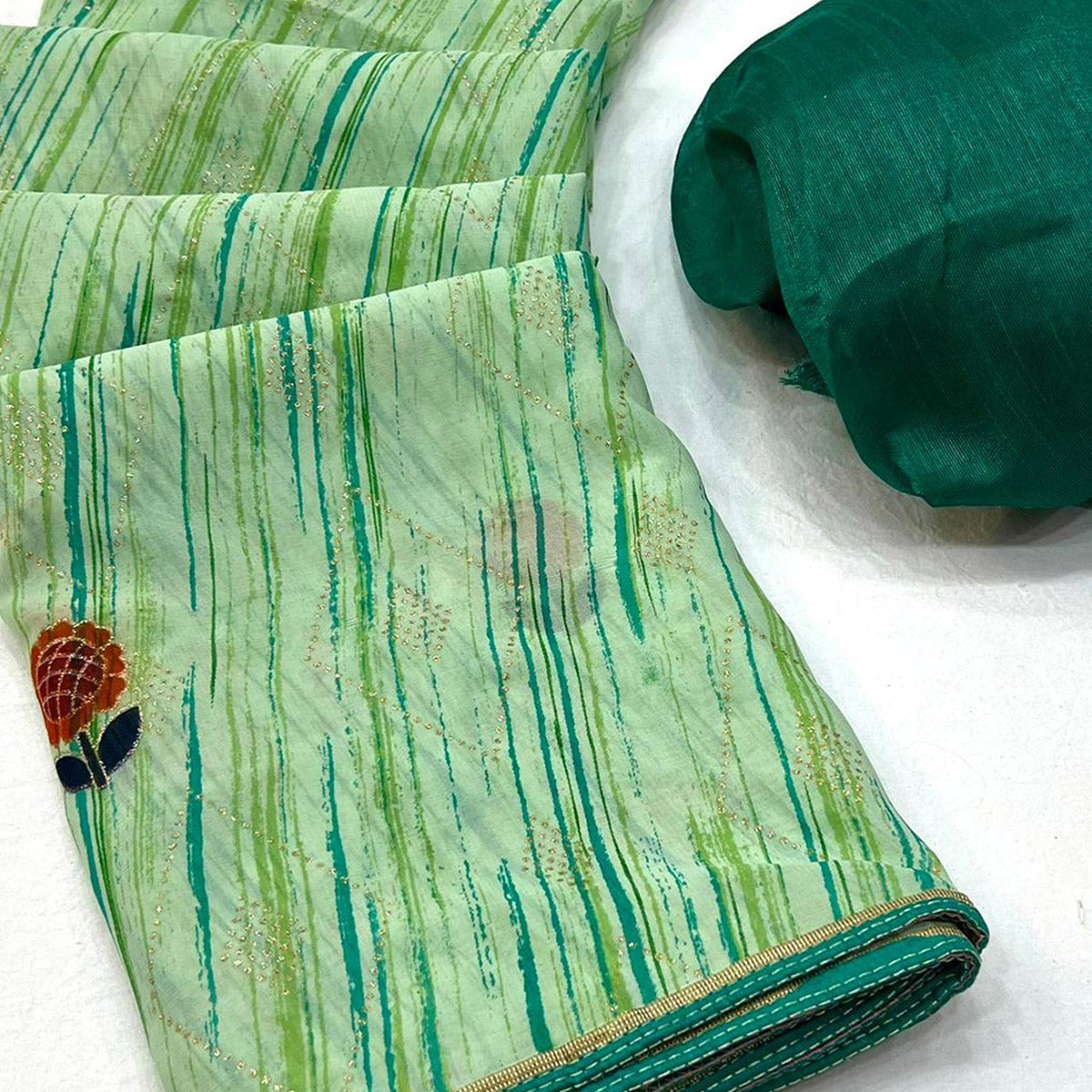 green-printed-raw-silk-saree-with-fancy-border