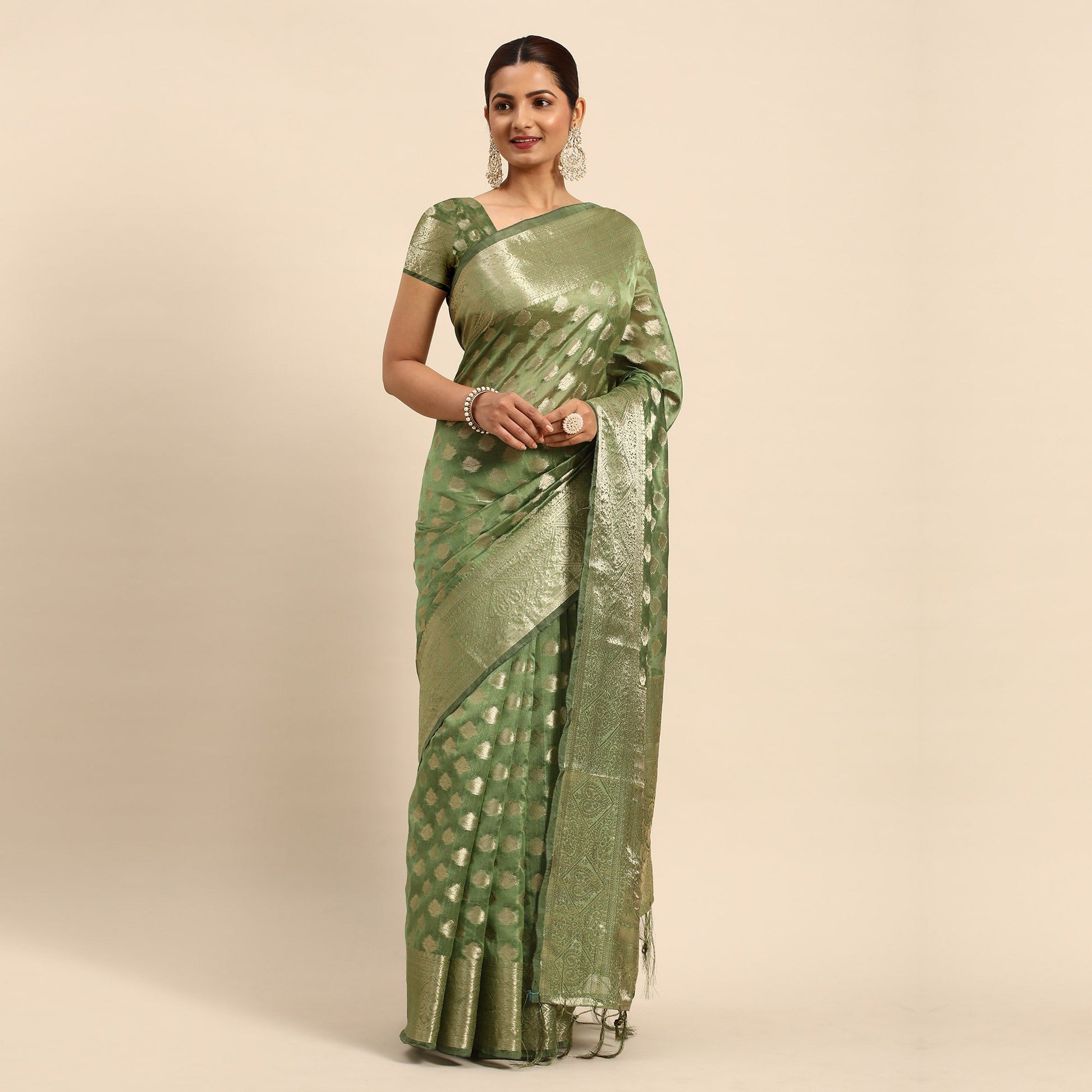 green-woven-organza-silk-saree-with-tassels-1