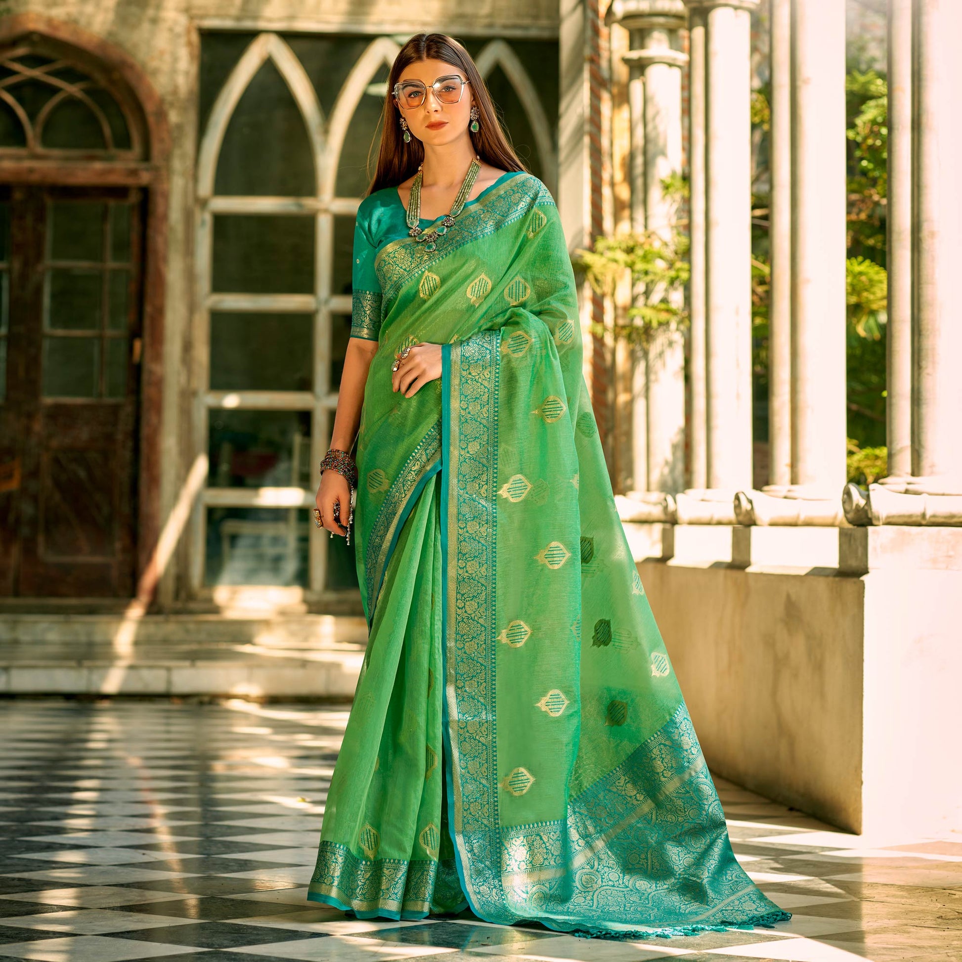 green-floral-woven-tissue-silk-saree-with-tassels-1