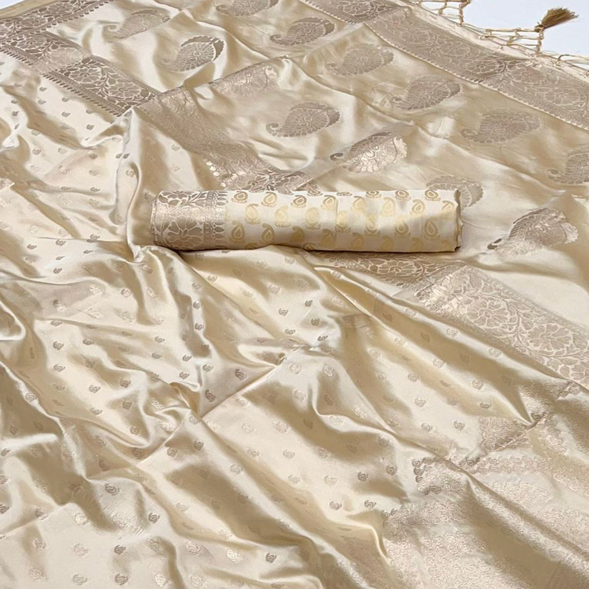 Cream Woven Satin Saree With Tassels