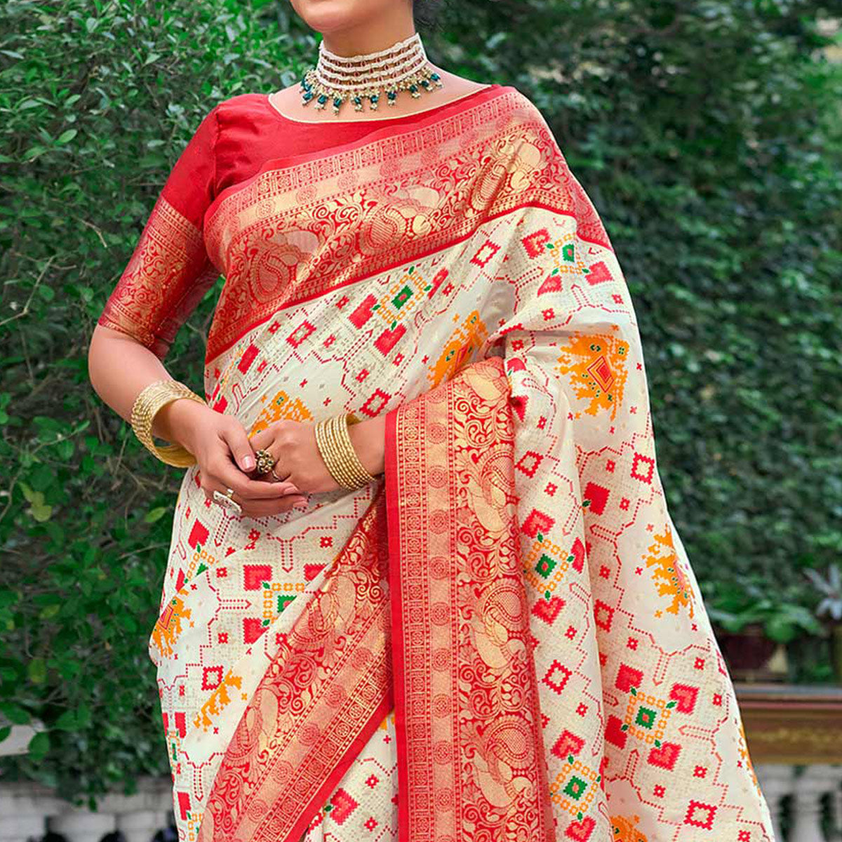 Cream Woven Art Silk Patola Saree With Tassels