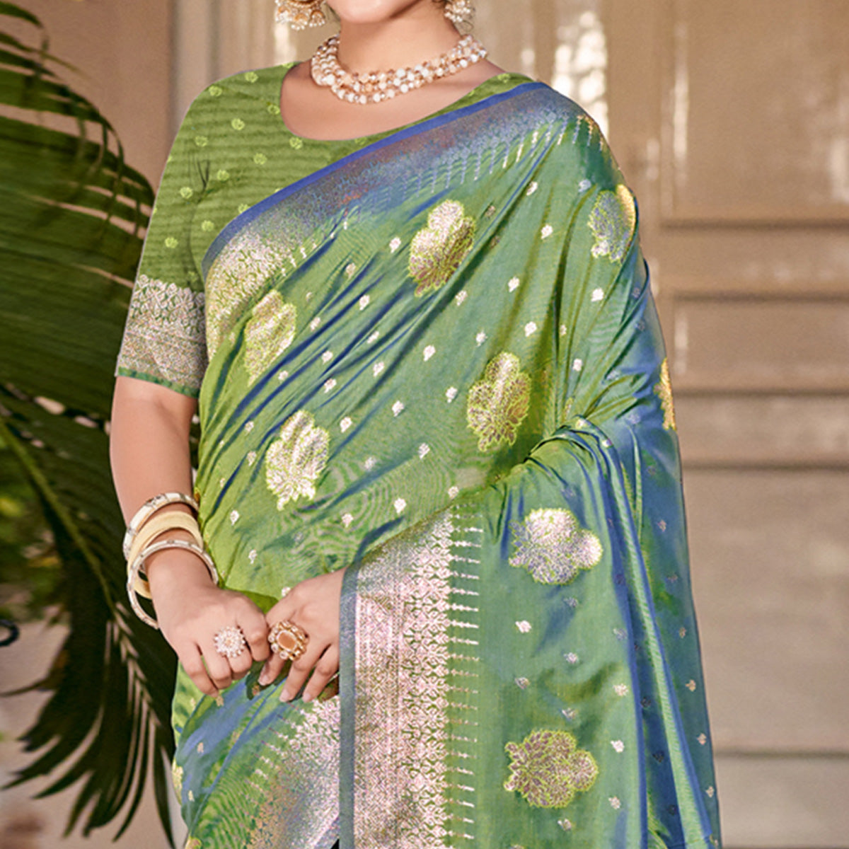 green-floral-woven-banarasi-silk-saree-with-tassels-12