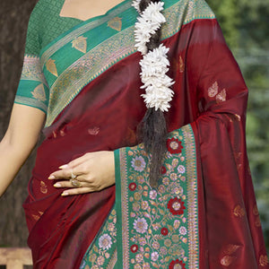 Maroon Floral Woven Banarasi Silk Saree With Tassels