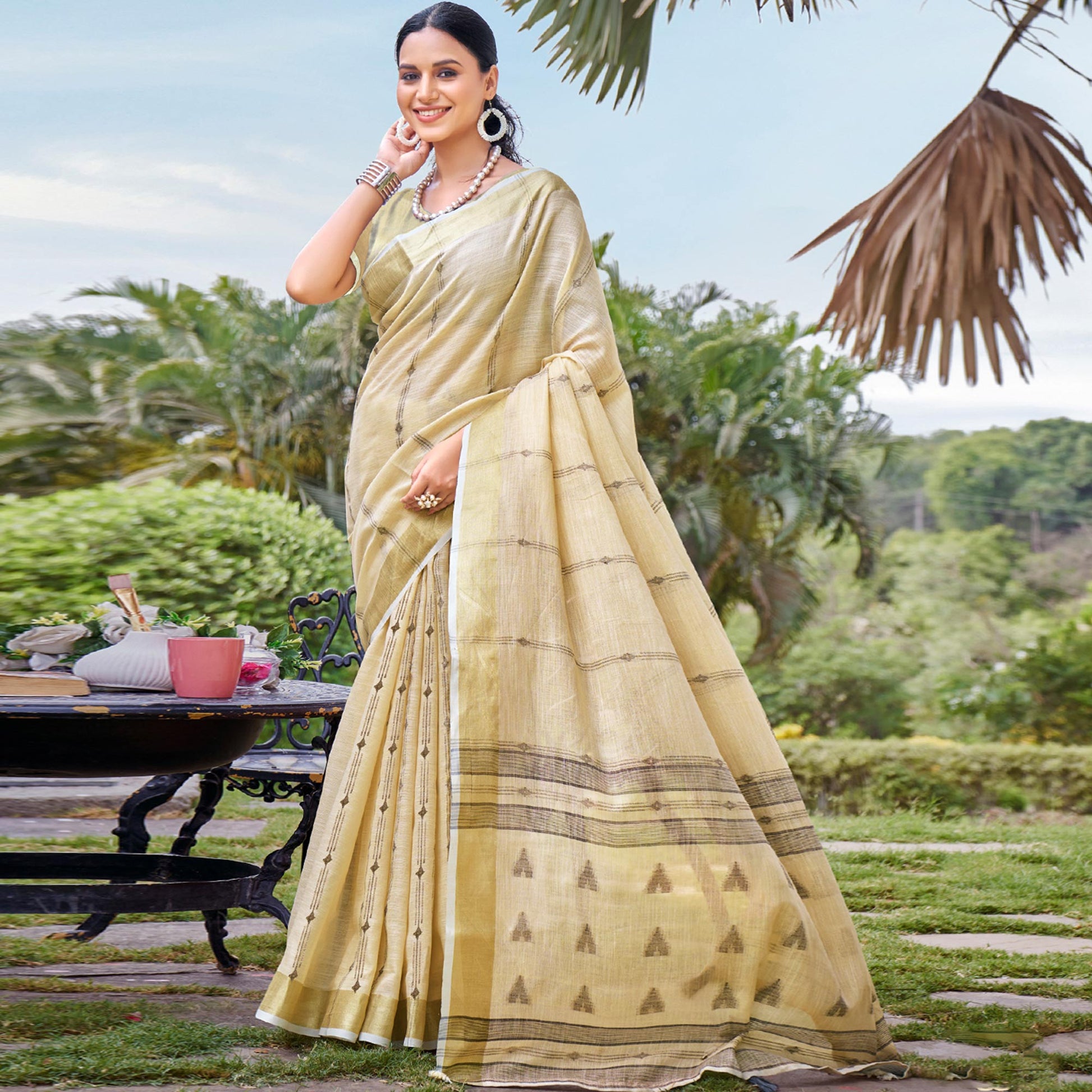 Cream Woven Cotton Blend Saree With Tassels