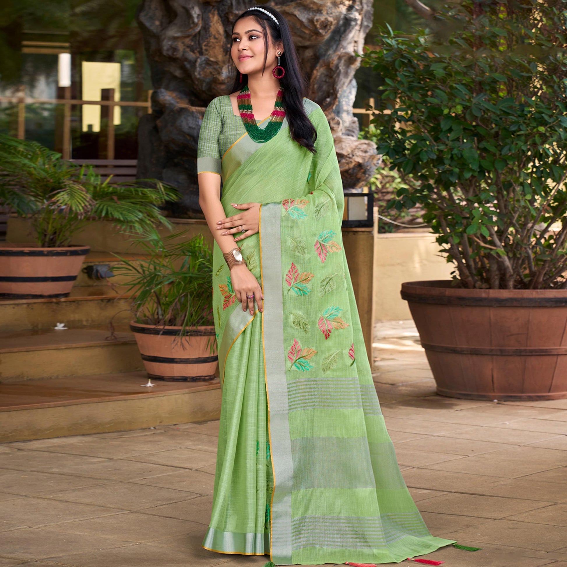 green-floral-embroidered-linen-saree-with-tassels