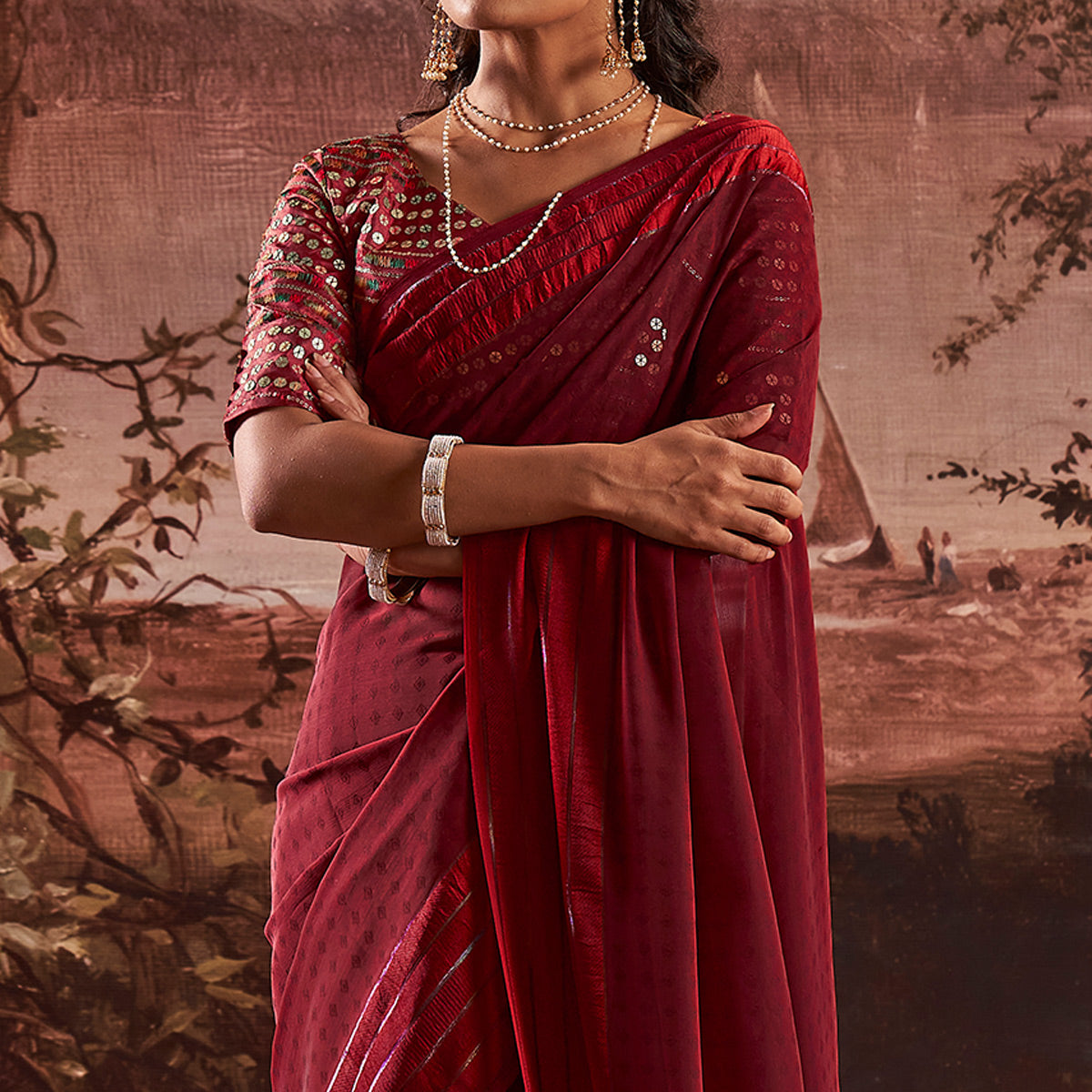 Maroon Woven Georgette Saree With Tassels