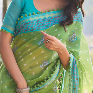 green-printed-cotton-blend-saree-with-pumpum-lace-1