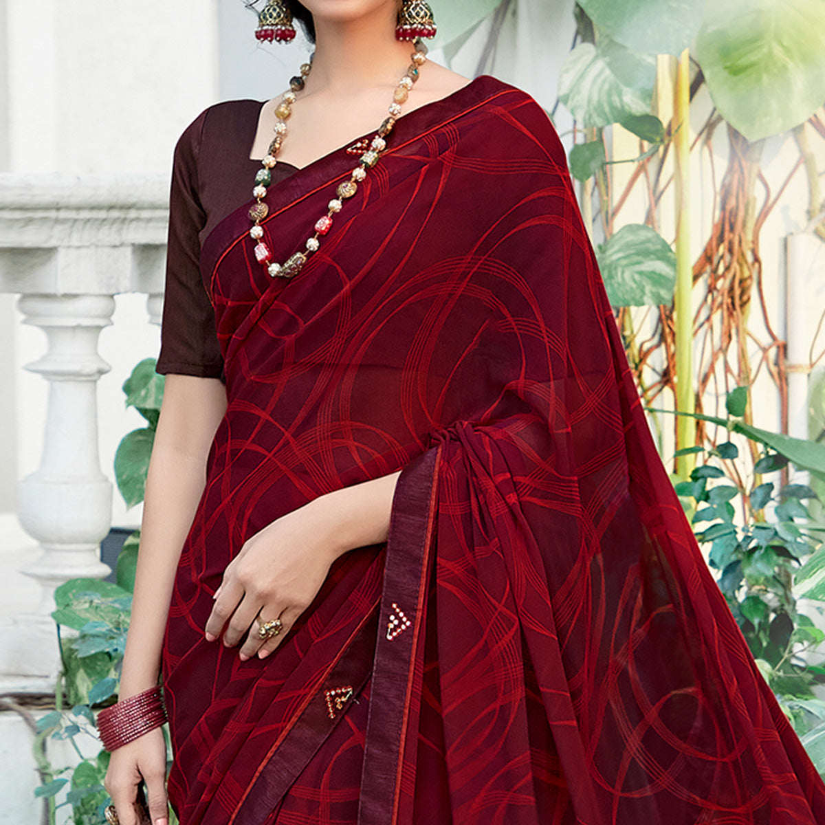 Maroon Geometric Printed Georgette Saree With Lace Border