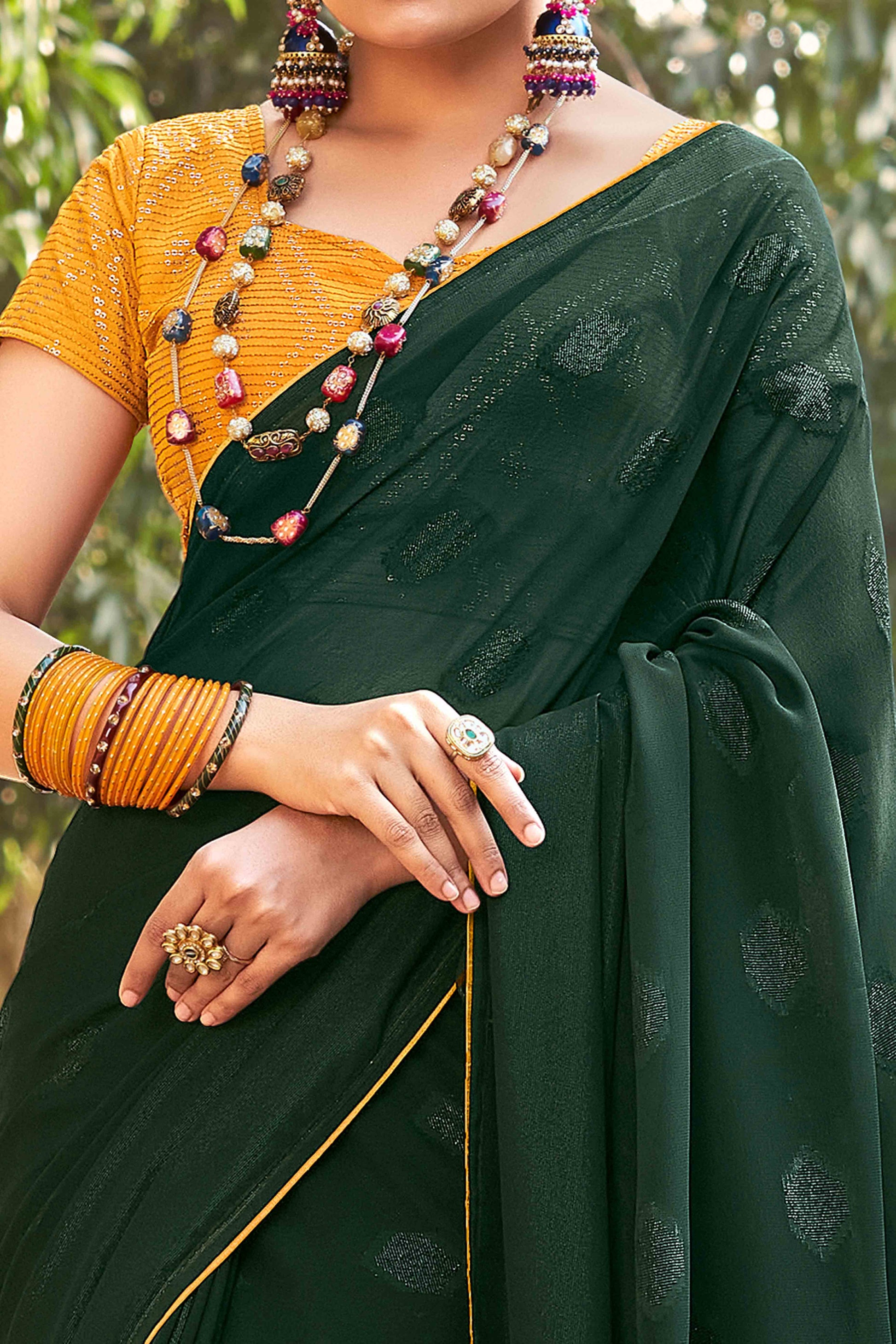 green-woven-georgette-saree-with-tassels-6