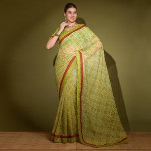 green-patola-foil-printed-georgette-saree-with-embroidered-border