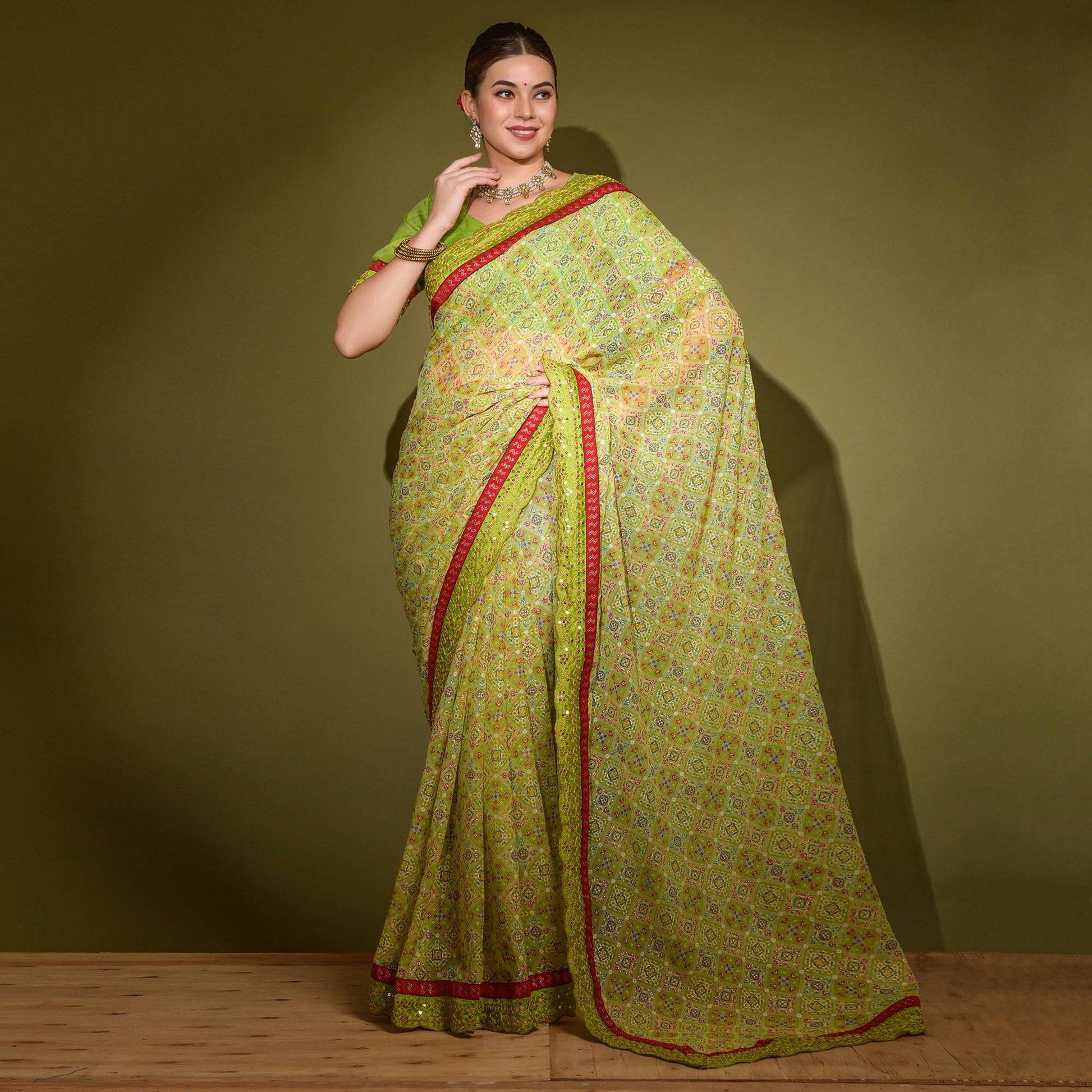green-patola-foil-printed-georgette-saree-with-embroidered-border