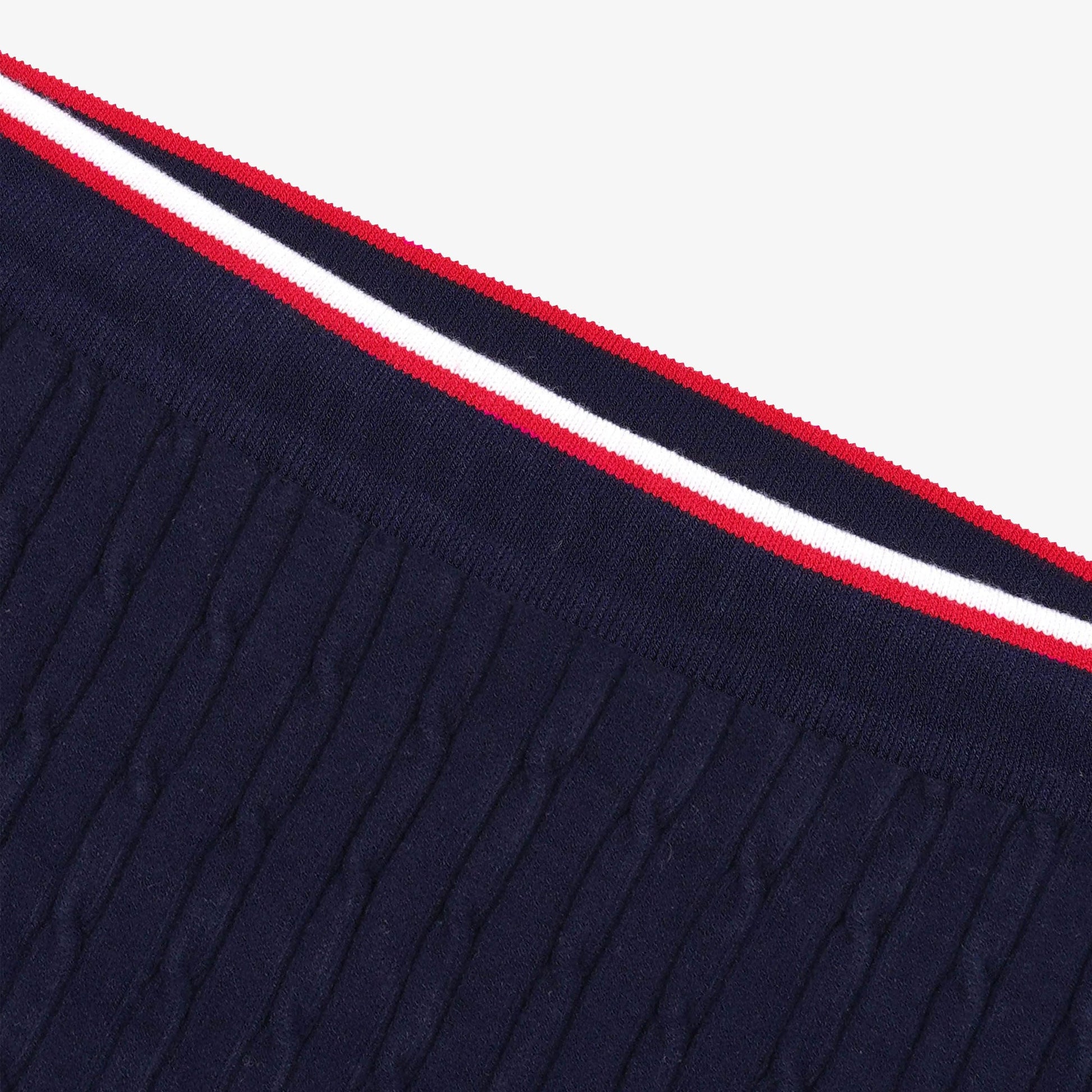 SPORTY & RICH | SERIF LOGO MINI CABLE SKIRT { NAVY