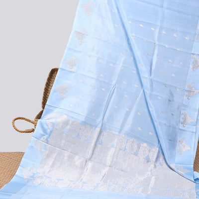 Blue floral buttas raw mango silk saree with self floral border & jaal zari design pallu
