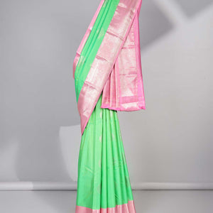 Green floral motifs gift saree with contrast paisley border & intricate zari design pallu