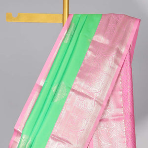 Green floral motifs gift saree with contrast paisley border & intricate zari design pallu