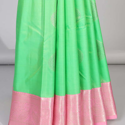 Green floral motifs gift saree with contrast paisley border & intricate zari design pallu