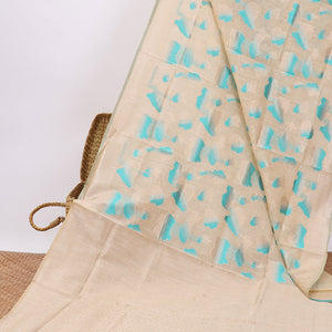 Cream intricate design semi-raw tussar saree with self border & plain pallu