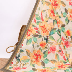 Cream floral digital printed crepe saree with contrast intricate design border