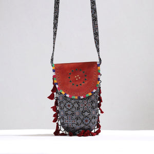Black - Kutch Leather & Mashru Silk Sling Bag with Tassels 33