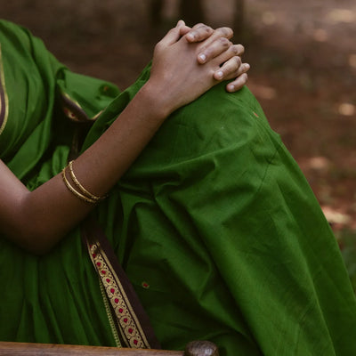 Green Handloom Kadapa cotton saree adorned with red Meenakari buttis