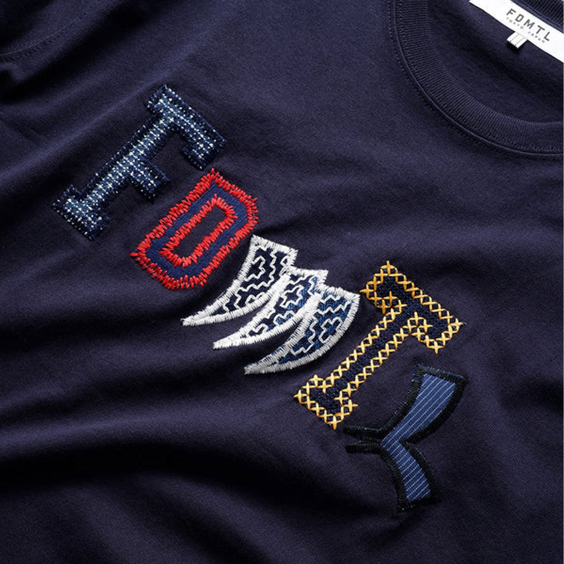 FDMTL | PATCHWORK LOGO TEE  { NAVY