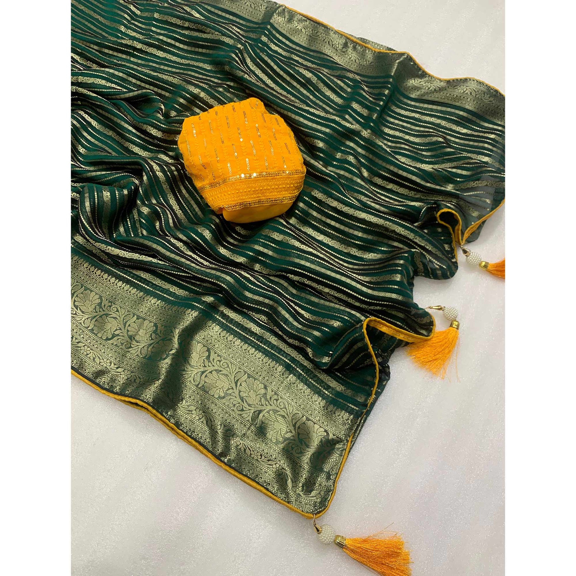 Dark Green Woven Georgette Saree With Tassels