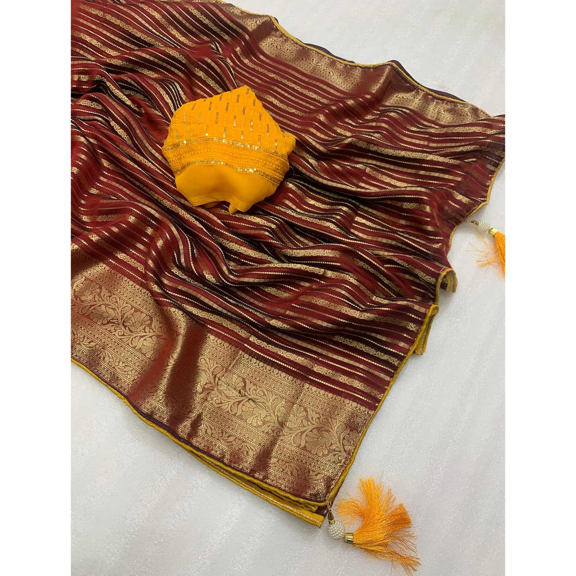 Maroon Woven Georgette Saree With Tassels