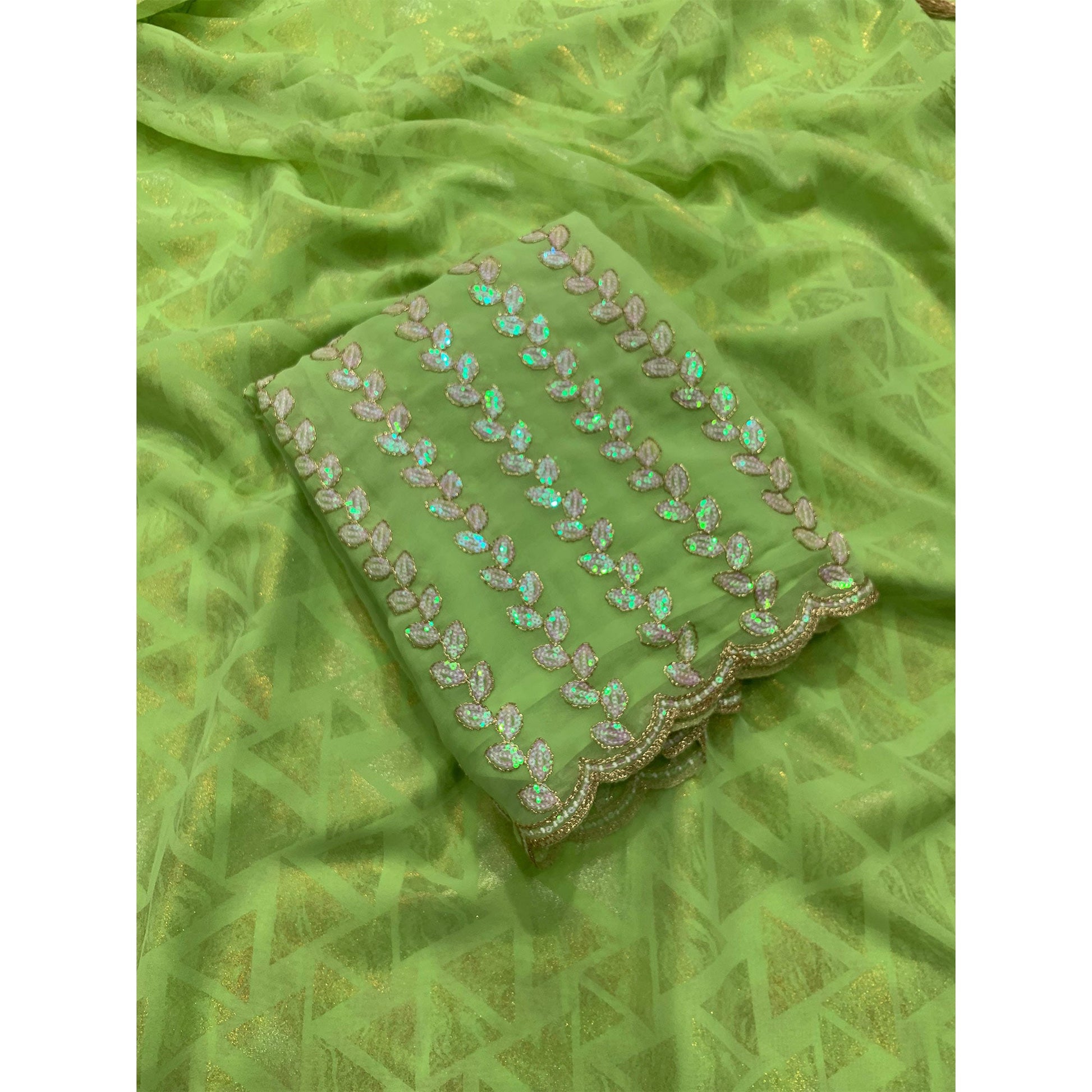 green-geometric-foil-printed-georgette-saree-with-tassels