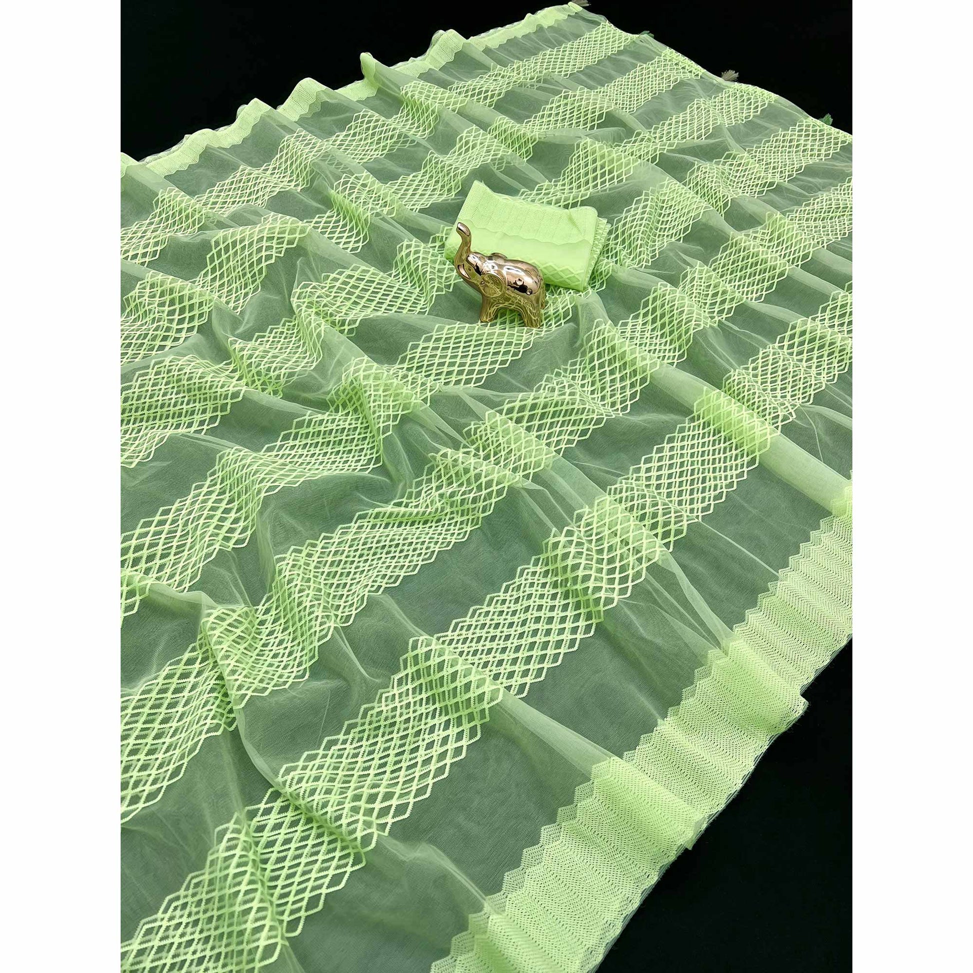 green-woven-thread-work-net-saree-with-tassels
