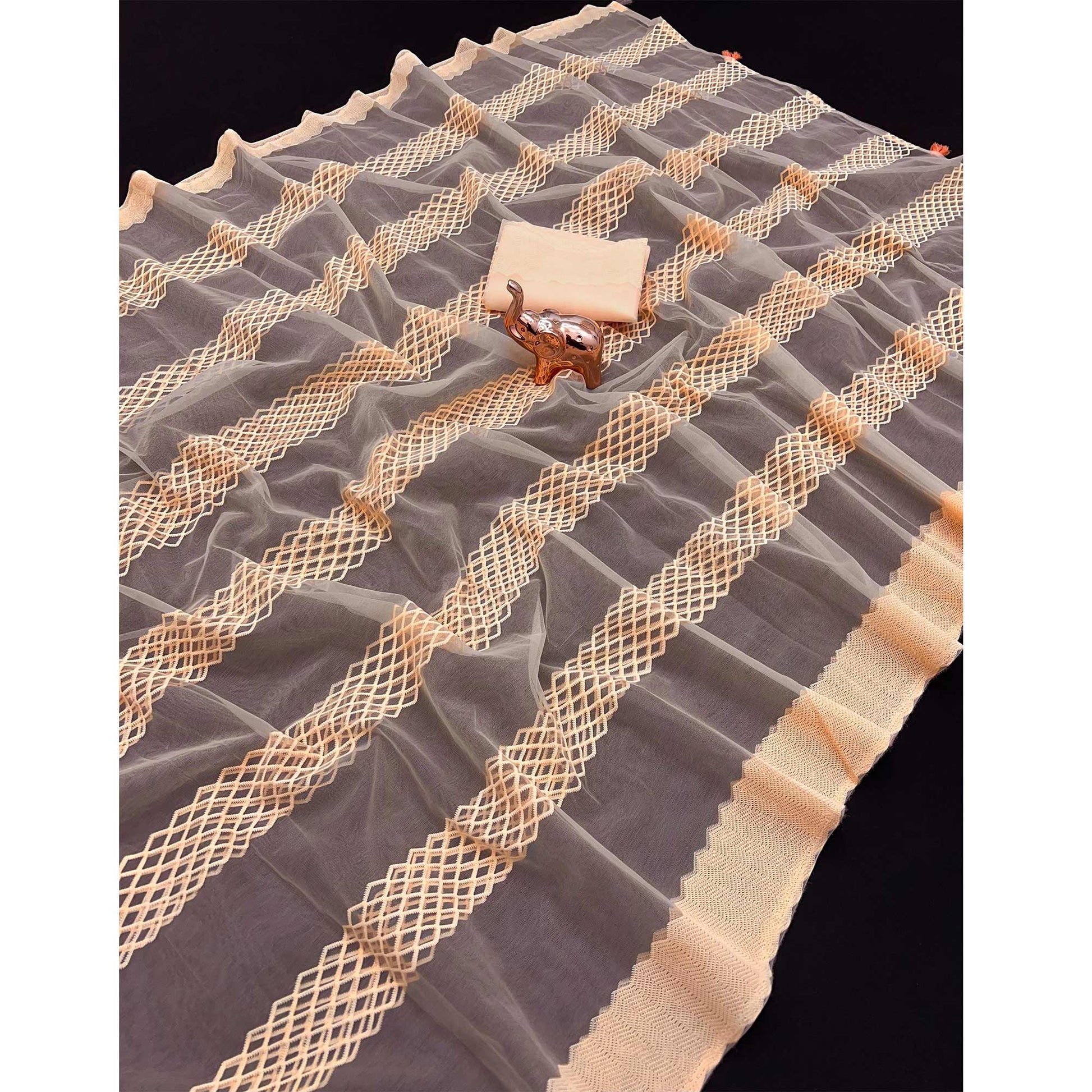 Light Peach Woven Thread Work Net Saree With Tassels