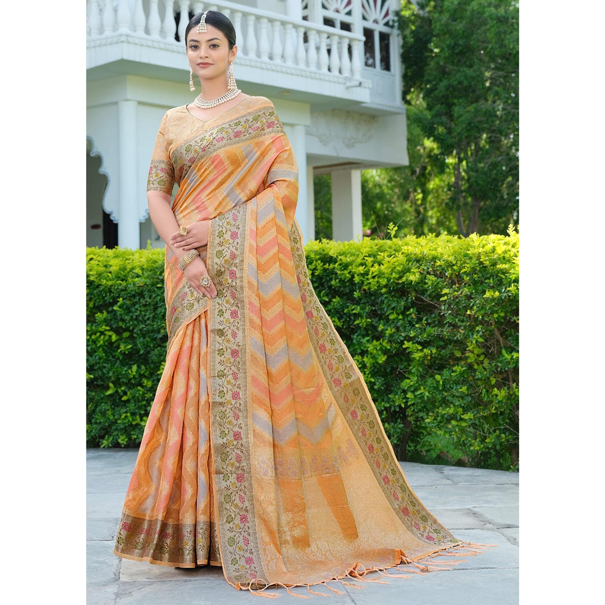 Light Orange Woven Organza Saree With Tassels