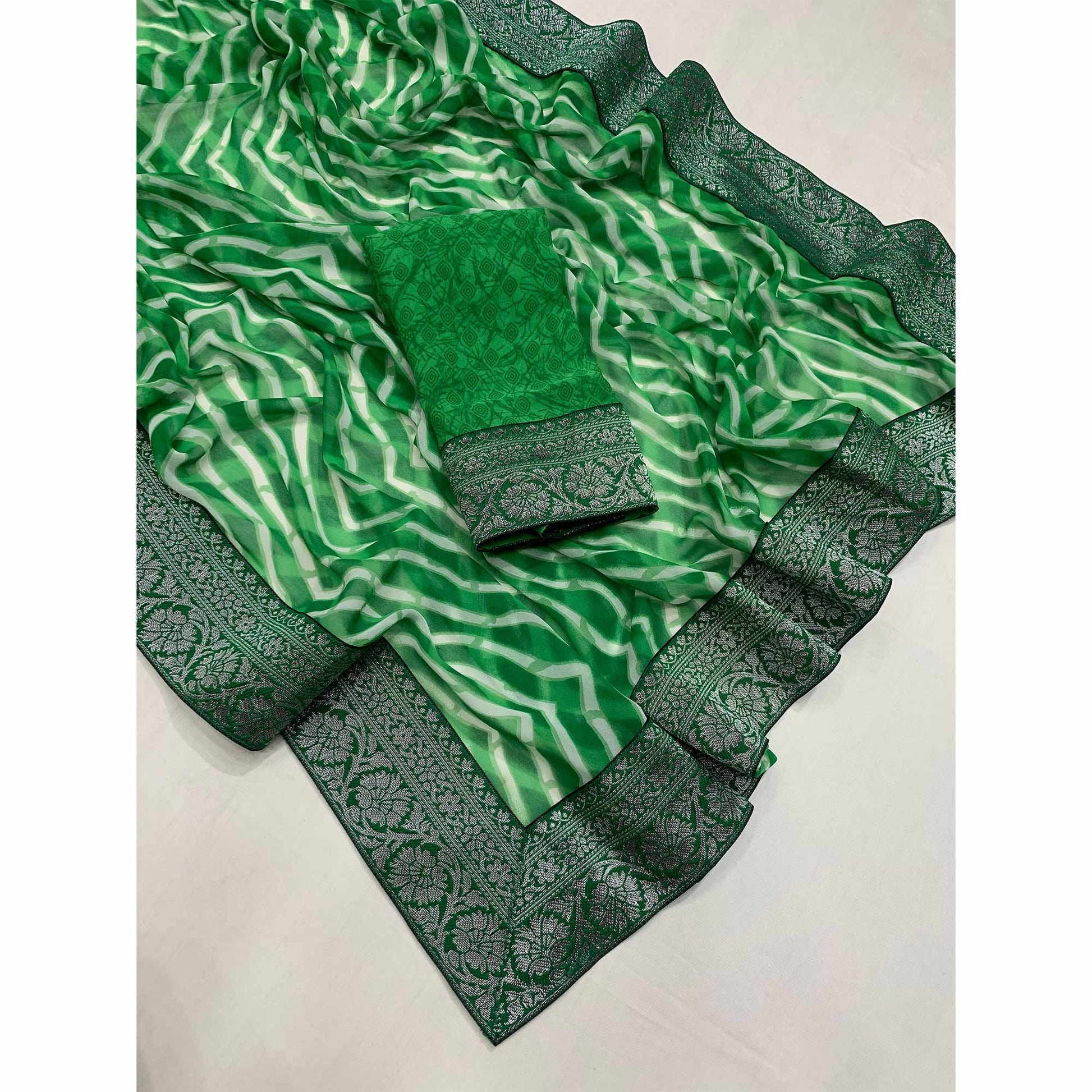 green-leheriya-printed-georgette-saree-with-woven-border