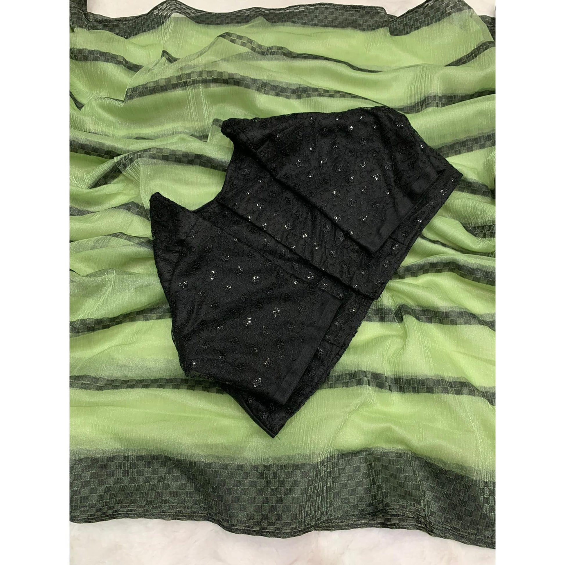 green-woven-net-saree-with-tassels