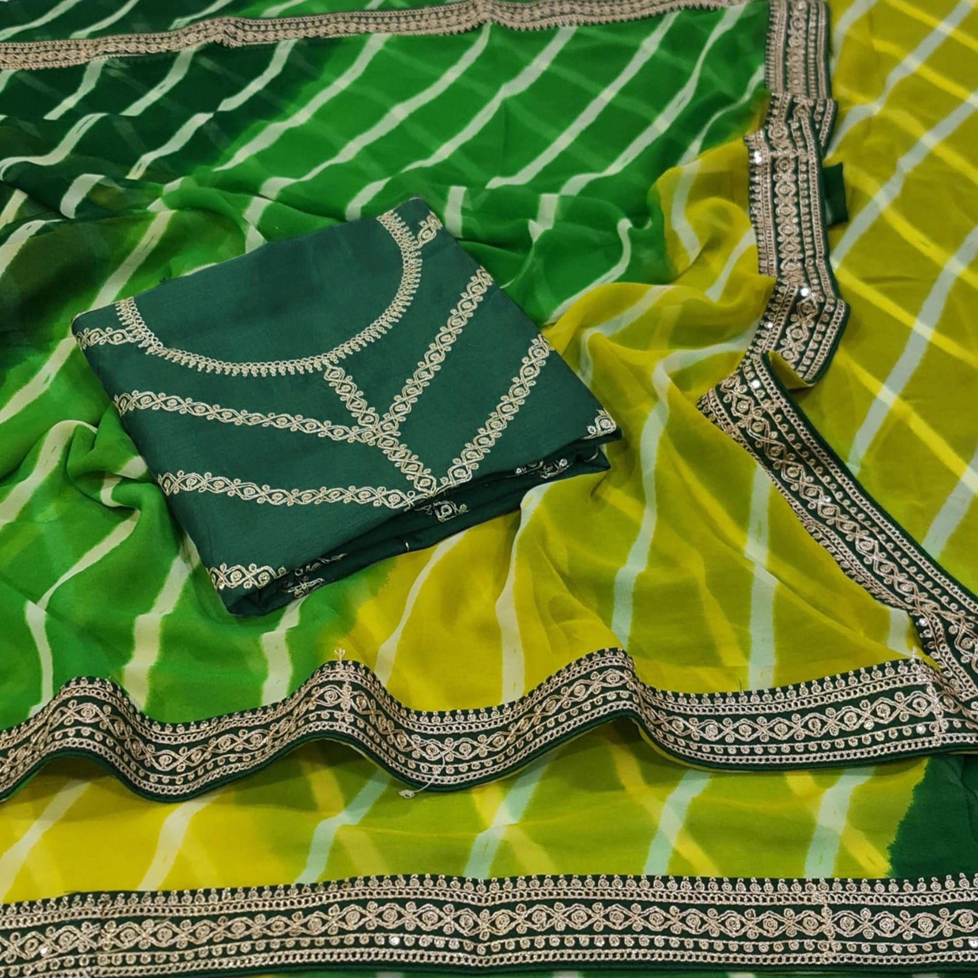 green-printed-georgette-saree-with-lace-border