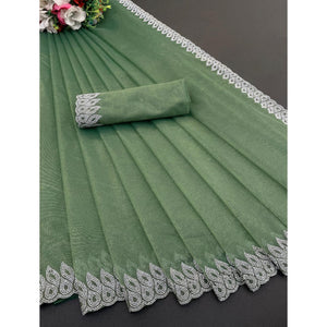 green-stone-work-embroidered-twill-gold-net-saree