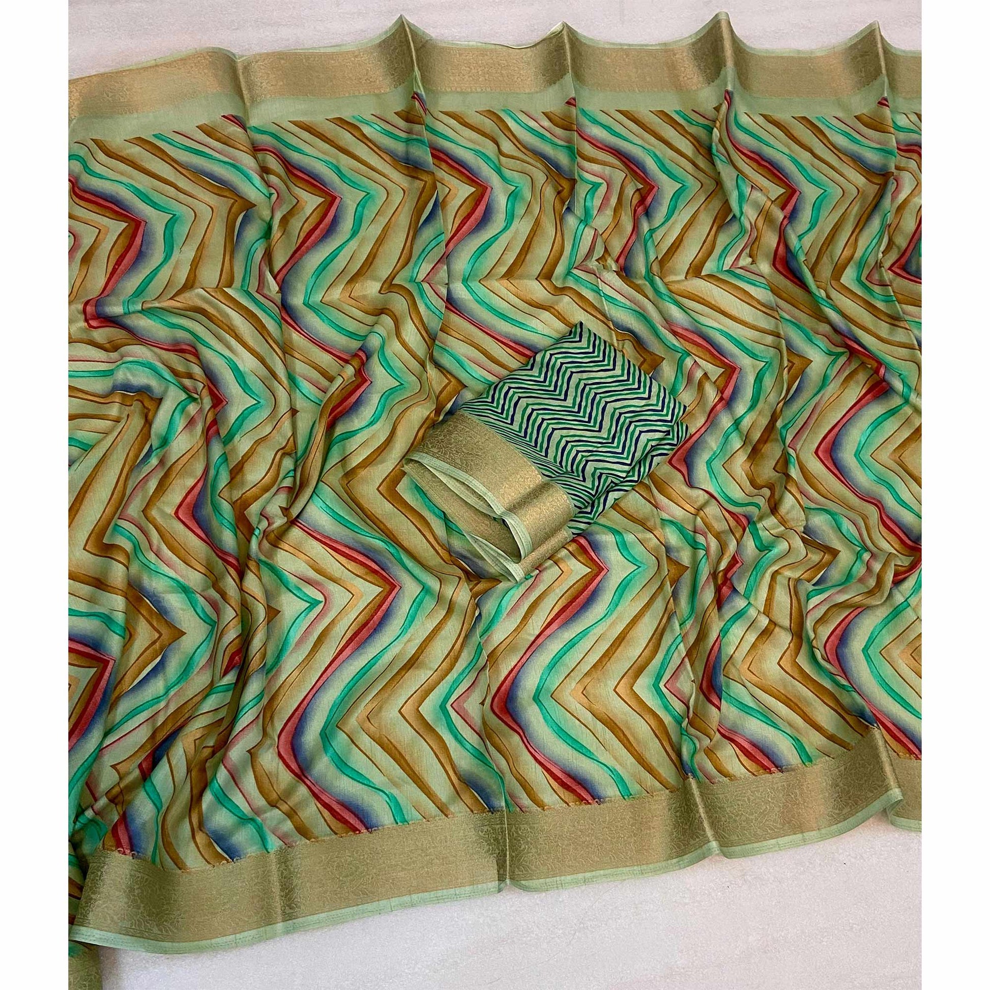 green-zig-zag-printed-dola-silk-saree-with-woven-border