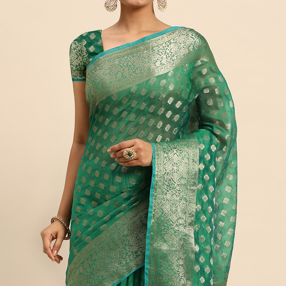 green-woven-organza-silk-saree-with-tassels
